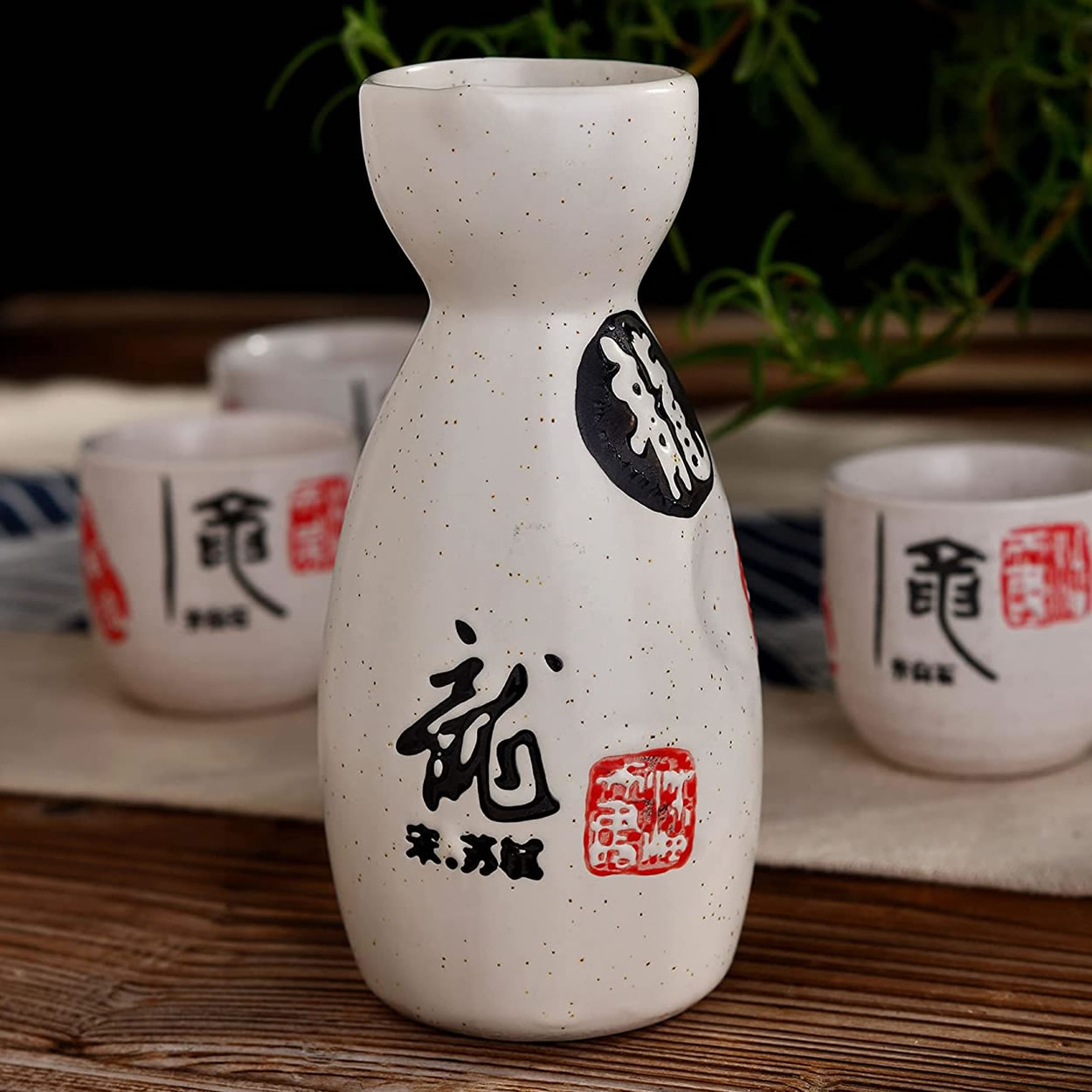 Poring Sake In Stoneware Sak Bottle